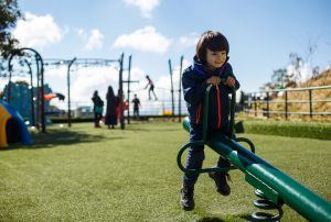 Kid enjoying seesaw at Chandragiri Anusement Park