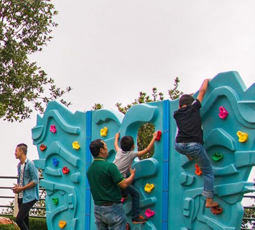 Children climbing a artificial rock wall at Chandragiri Amusement Park